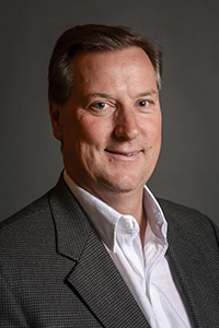 Mark Challis, Founder of Directed Equity, smiling professional headshot